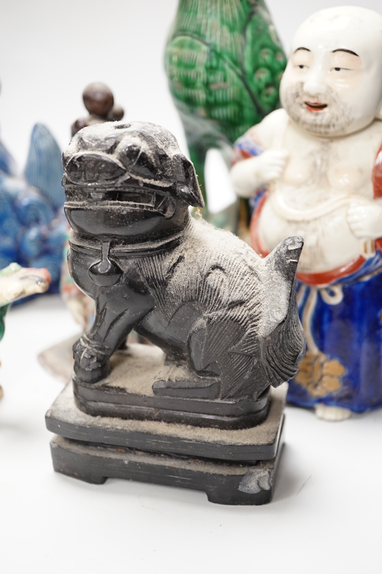 A group of assorted Chinese and Japanese pottery and porcelain figures, 19th/20th century, tallest 26cm high